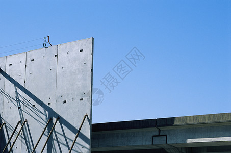 混凝土墙的建造天空进步蓝色鲁棒性建筑学工作财产大厦建筑弹力背景