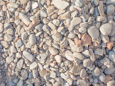 石头背景碎石圆形灰色岩石材料背景图片