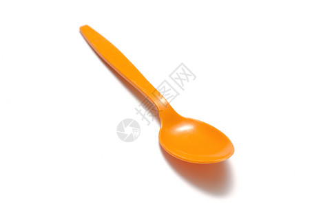 橙色塑料勺厨房用具餐具工作室餐厅桌子食物橙子白色刀具背景图片