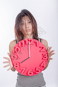 疲劳的亚洲妇女守时时间背景图片