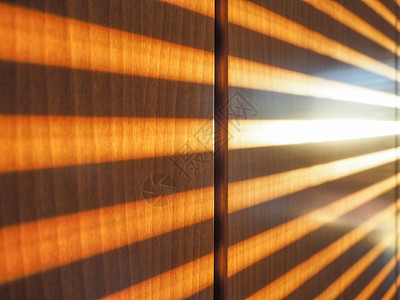 太阳光穿过百叶窗木头射线快门背景图片
