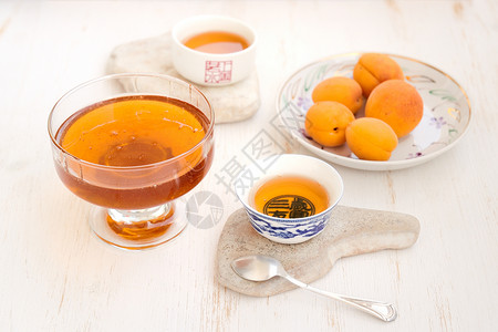 茶点心杏子 蜂蜜和茶背景