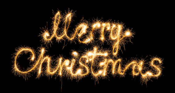 圣诞黑色圣诞快乐 由黑色的火花制成烟火周年写作烧伤纪念日字母金子橙子字体焰火背景