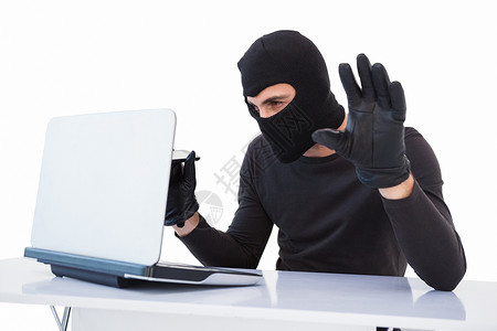 监察法重点重点盗贼侵入笔记本电脑法帽专注骇客身份男人犯罪网络技术刑事男性背景