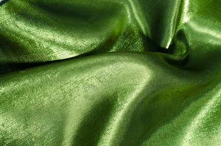 绿色丝织织物布料奢华丝绸金子材料背景图片