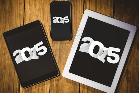 2015年复合图像触摸屏手机电脑新年药片电话屏幕平板展示背景图片