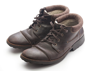 冬季靴皮革鞋类毛毡棕色靴子背景图片