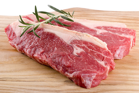 牛排迷迭香牛肉木板香料牛扒食物背景图片