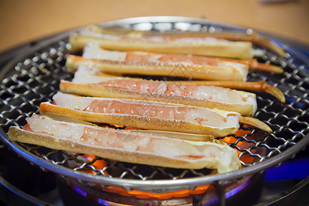 烤蟹腿美食炙烤烧烤海鲜烹饪食物高清图片