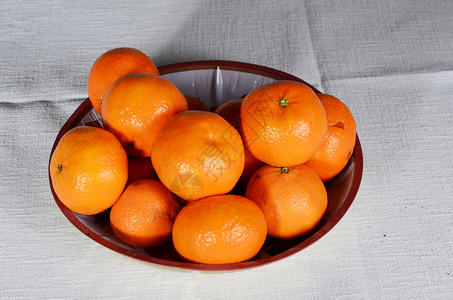 橘红色小吃桌子橙子橘子水果背景图片