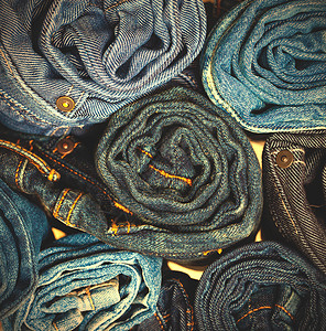 牛仔裤长裤堆青少年裙子蓝色裤子店铺衣服靛青纺织品服饰织物背景图片