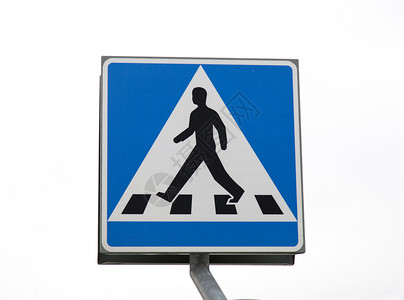 人行横道标志十字路口标志蓝色白色街道男人穿越行人背景