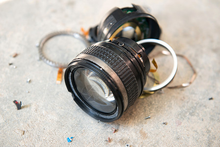 相机镜头破损金属电子产品玻璃服务地面照片维修塑料镜片摄影背景图片
