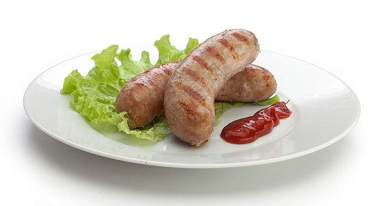 烤香肠美食隔断白色肉制品绿色盘子红色油炸烧烤食物背景图片