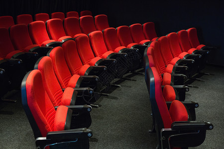 红色席位的空行电影业礼堂椅子座位电影院时间文艺演出背景图片