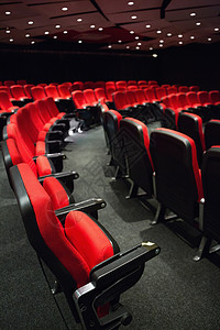 来宾席位红色席位的空行座位文艺椅子演出礼堂电影业时间电影院背景