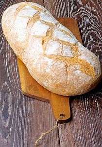 大面包早餐健康饮食糕点小麦全身砧板碳水饮食包子面团背景图片