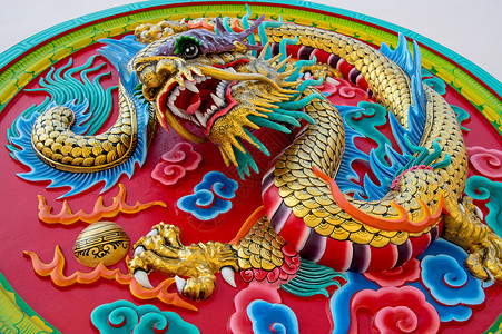 以中文风格的龙文土科解脱红色想像力艺术品艺术手工动物宽慰天空浮雕金子背景图片
