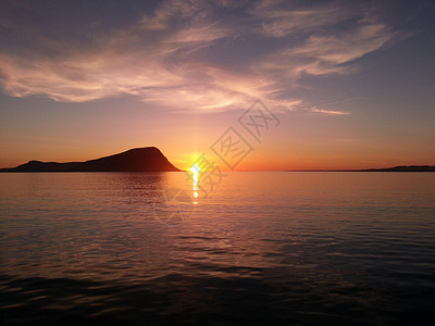 岛屿日落晴天黄色天空海岸背景图片