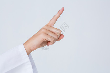 医生指向空中的手指手势药品背景图片