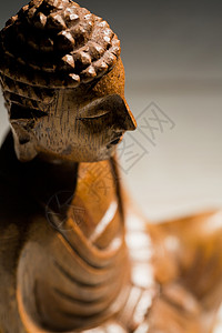 桌子上的佛像阴影信仰雕塑冥想宗教雕像塑像沉思背景图片