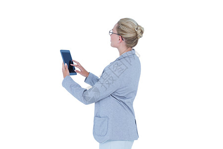 女商务人士使用平板电脑女性职业工作触摸屏商业滚动人士套装休闲商务背景图片