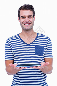 英俊的嬉皮士对着照相机微笑并拿着平板电脑棕色男性头发潮人触摸屏药片男人短发滚动背景图片