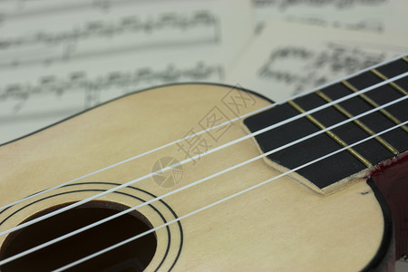 从音乐中解脱歌曲身体声学细绳白色四弦乐器古董笔记脖子背景图片