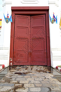 门旗身挂Bangkok寺庙旗的泰兰和阿西亚阴影三位一体宗教旅行人行道雕塑马赛克艺术路面金属背景