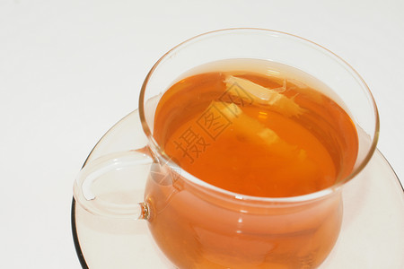 茶绿色液体宏观红色黑色水果飞碟柠檬早餐棕色背景图片