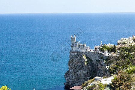 悬崖燕子海边的城堡房子旅游天空游客假期灯塔旅行石头日出蓝色背景