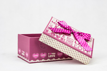 粉色圆点蝴蝶结礼品盒礼品袋粉色盒子白色丝带展示内阁礼物创意浪漫背景