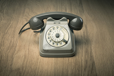 硬木表面的旧电话背景图片