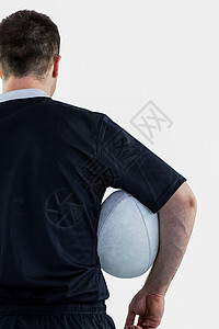 持有橄榄球的橄榄球运动员运动服装体育竞赛球衣黑色竞技男人运动服男性背景图片