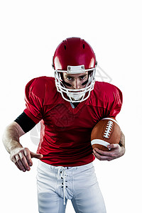 红色足球素材集中的美国足球运动员们准备进攻的肖像 他们正准备发动攻击活动战绘头盔运动员竞技体育运动服四分卫力量面漆背景