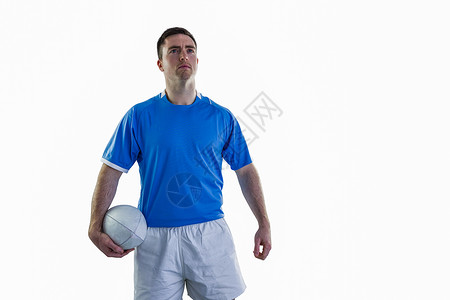 持有橄榄球的橄榄球运动员播放器微笑蓝色专注男人运动服球衣服装竞赛体育背景图片