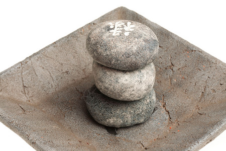 日本愈合石 风水石疗效照片康复传统灰色符号圆形象征性石头温泉背景图片