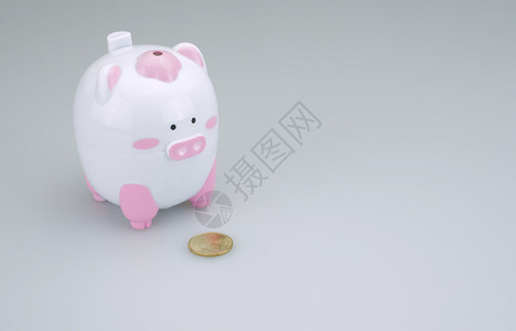 一个硬币的猪银行背景图片