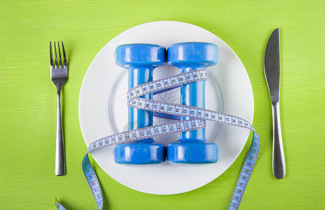 多余健康生活方式 饮食 运动的概念以及蓝色体重食物厘米营养肥胖绿色身体盘子减肥背景