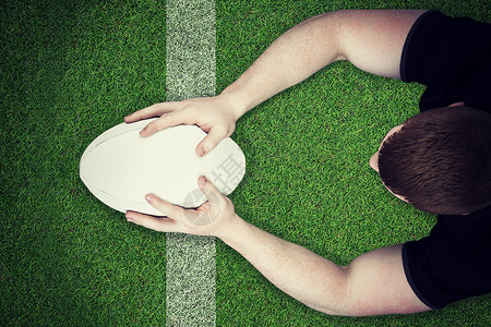 一个橄榄球运动员的复合图像 尝试得分沥青专注竞技播放器体育竞赛运动服运动服装分数背景图片