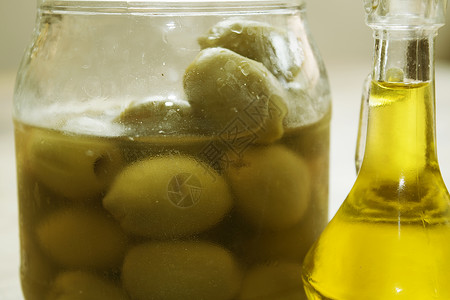 罐中油脂和橄榄背景图片