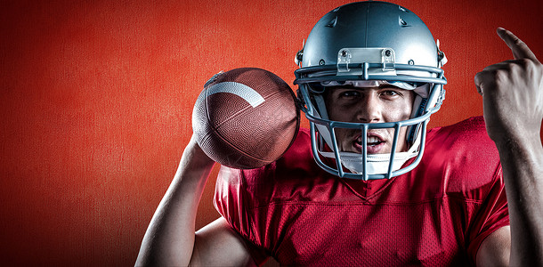 手指足球美国足球运动员在握球时出击的复合图像合成图象 照片来源男性运动服装头盔红色插图体育手势混血头饰背景
