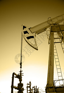石油钻机石油泵千斤顶棕褐色机械工业化石油田管道活力石油矿业背景