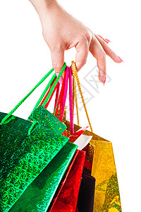手上挂着袋子绿色白色礼物购物黄色销售女性包装商品红色背景图片