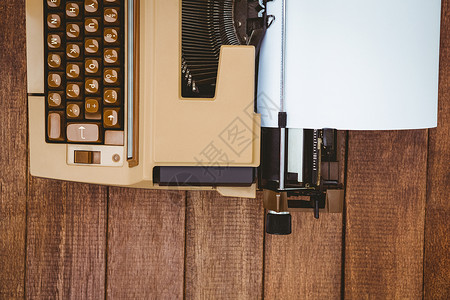 旧打字机视图沟通工具复古木头书写技术职场打字机棕色键盘背景图片