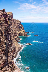 洛伦索马德拉 圣洛伦科角的悬崖海岸火山旅游风景踪迹岩石蓝色海洋波峰半岛游客背景