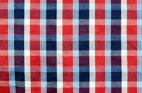 苏格兰面料短裙格子时尚纺织品材料红色背景图片