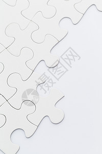白色背景上的 Jigsaw 拼图空白游戏纸板团体玩具闲暇背景图片