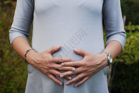 怀孕妇女女性身体辅导婴儿肚子背景图片