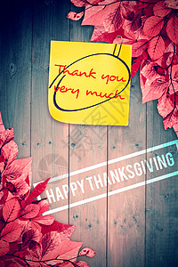 快乐感恩的复合形象橙子树叶木头笔记红色叶子桌子背景图片